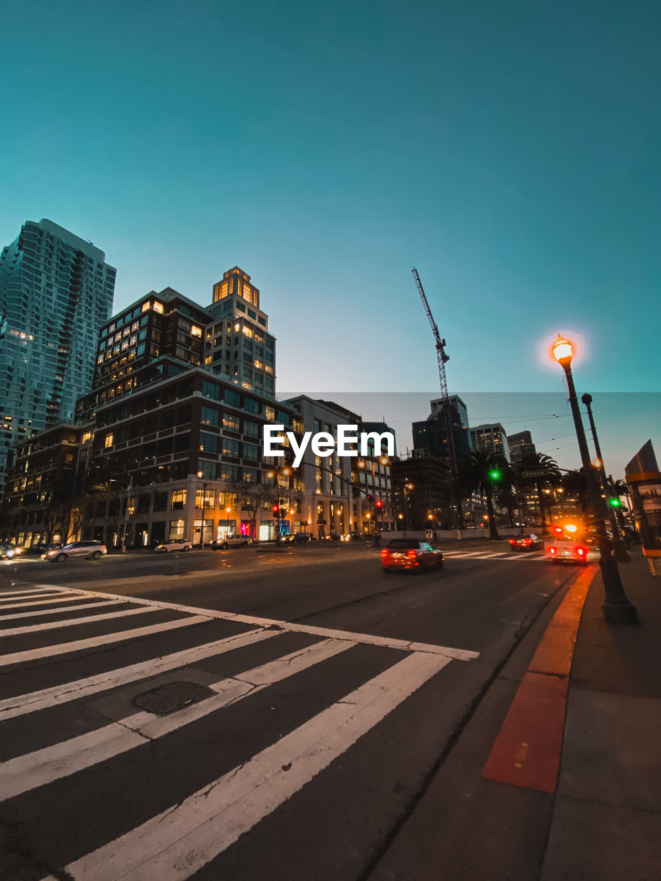 CITY STREET AND BUILDINGS AGAINST CLEAR SKY