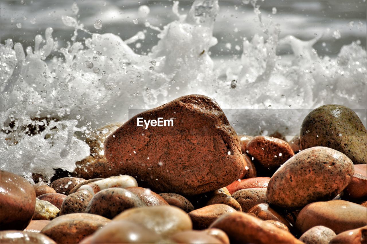 Close-up of stones on beach