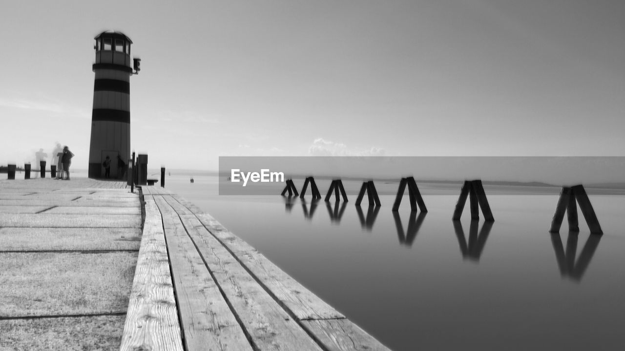 Pier over sea against clear sky