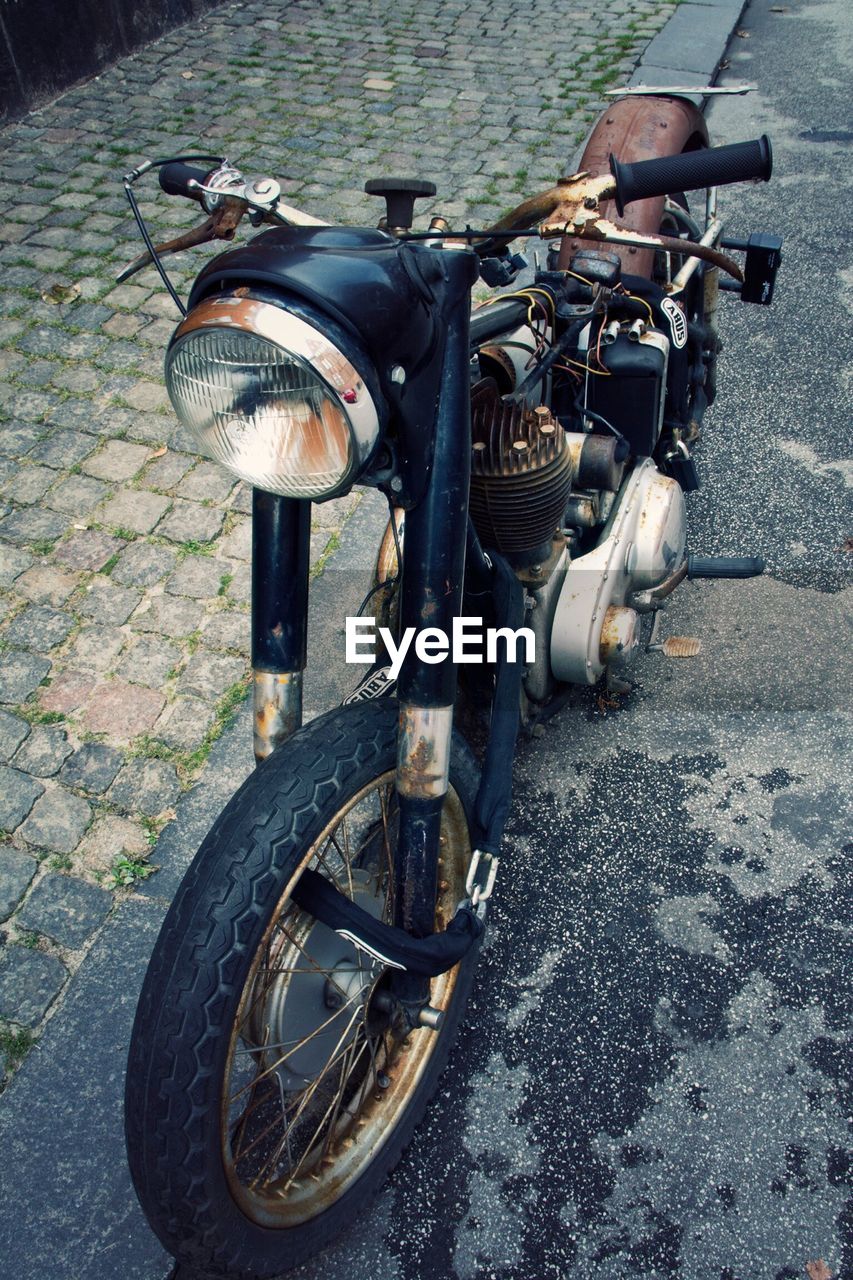 High angle view of abandoned motorcycle on street