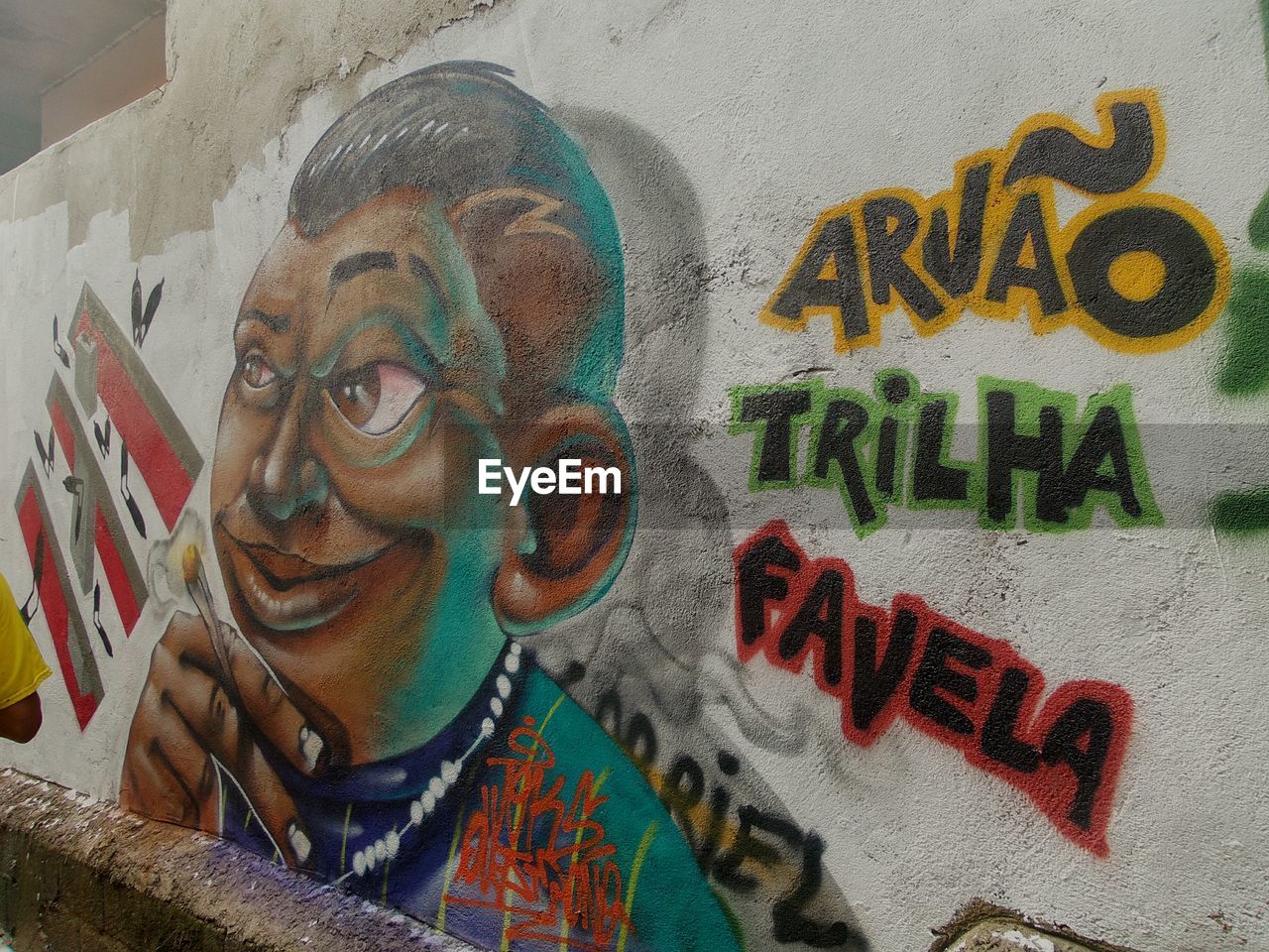 CLOSE-UP OF MAN WITH MULTI COLORED PAINT