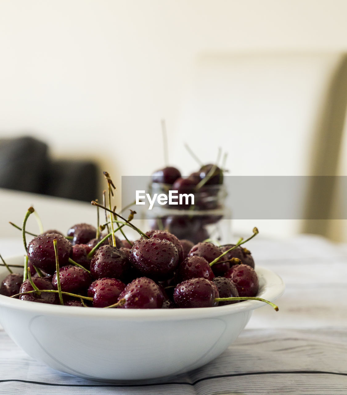 Close-up of red cherries in bowl on table