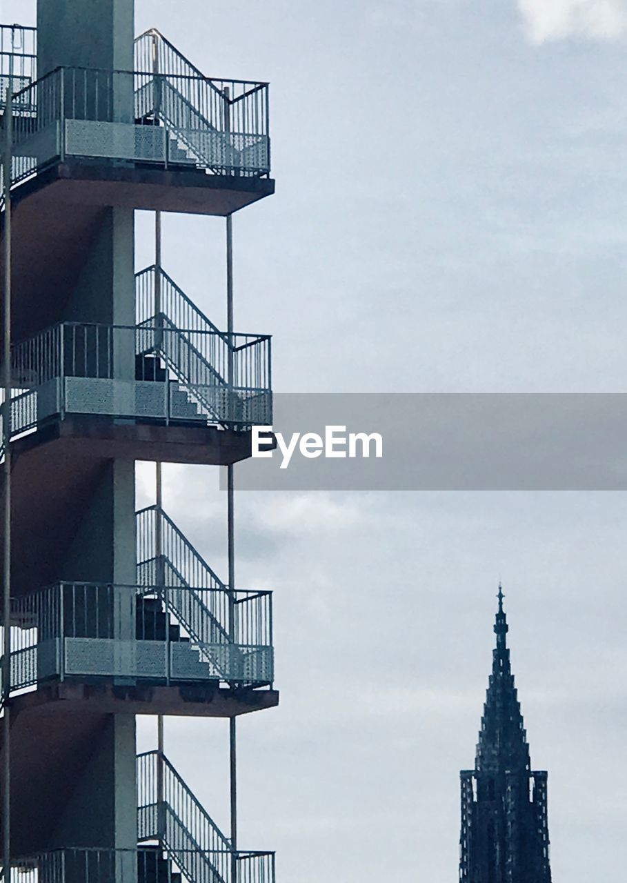 Low angle view of staircase building against sky