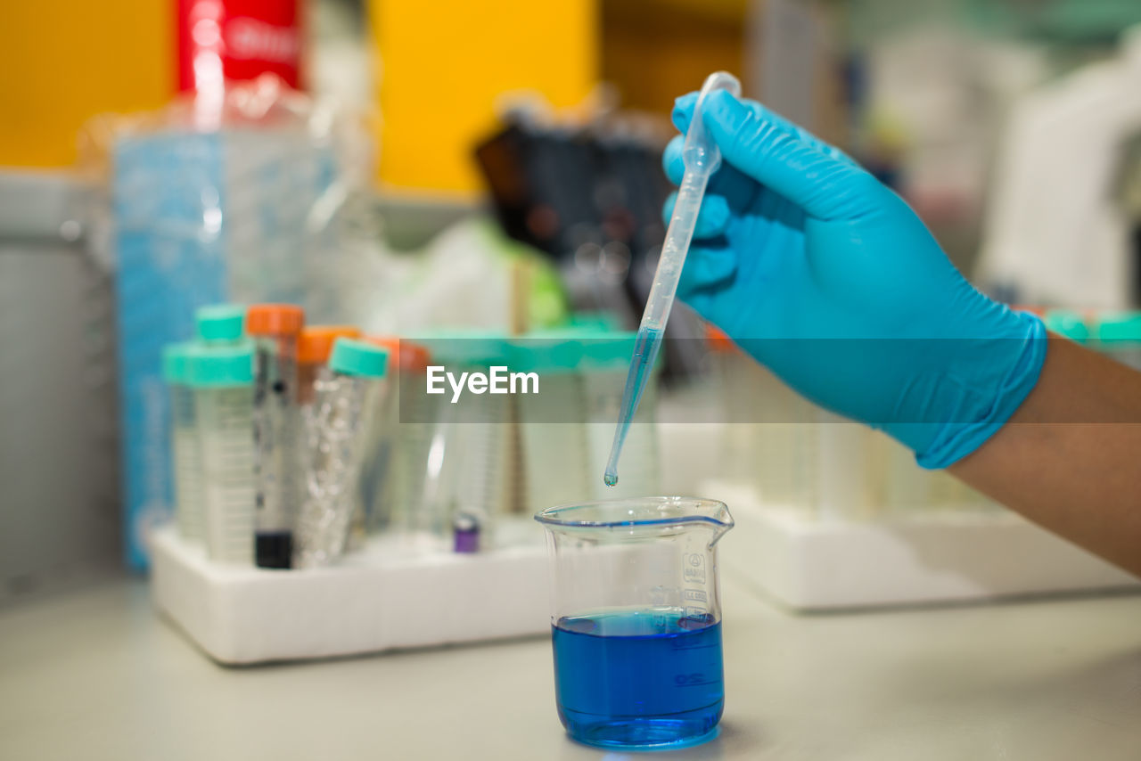 Cropped hands of scientist experimenting in laboratory