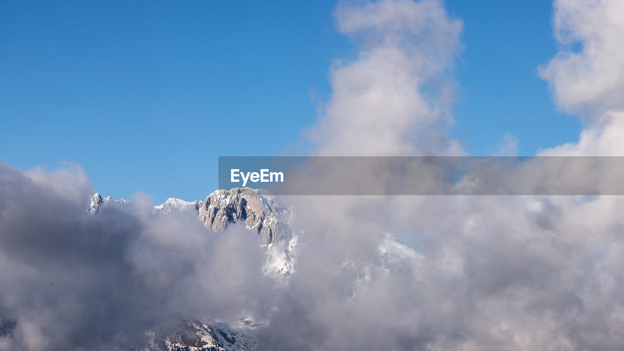 Low angle view of snow against sky