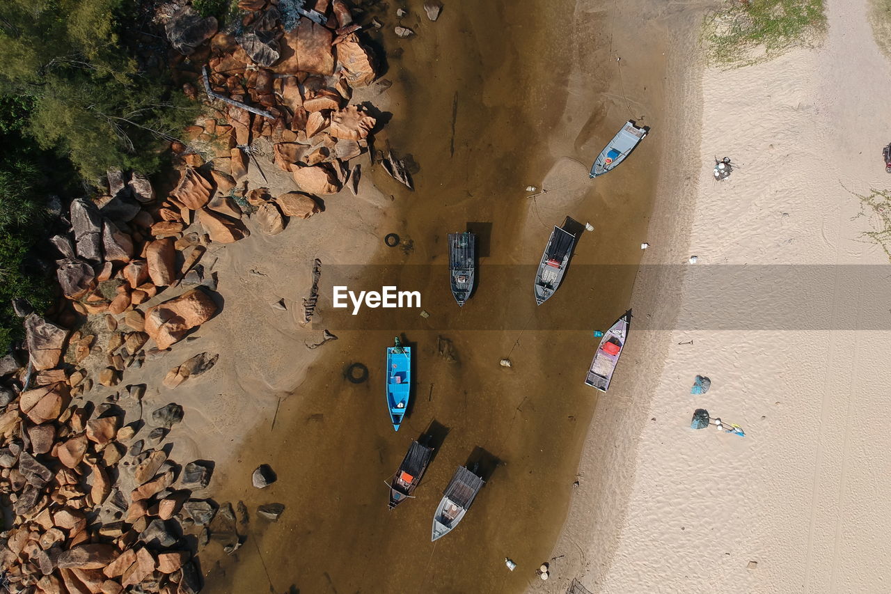 Boats moored at beach