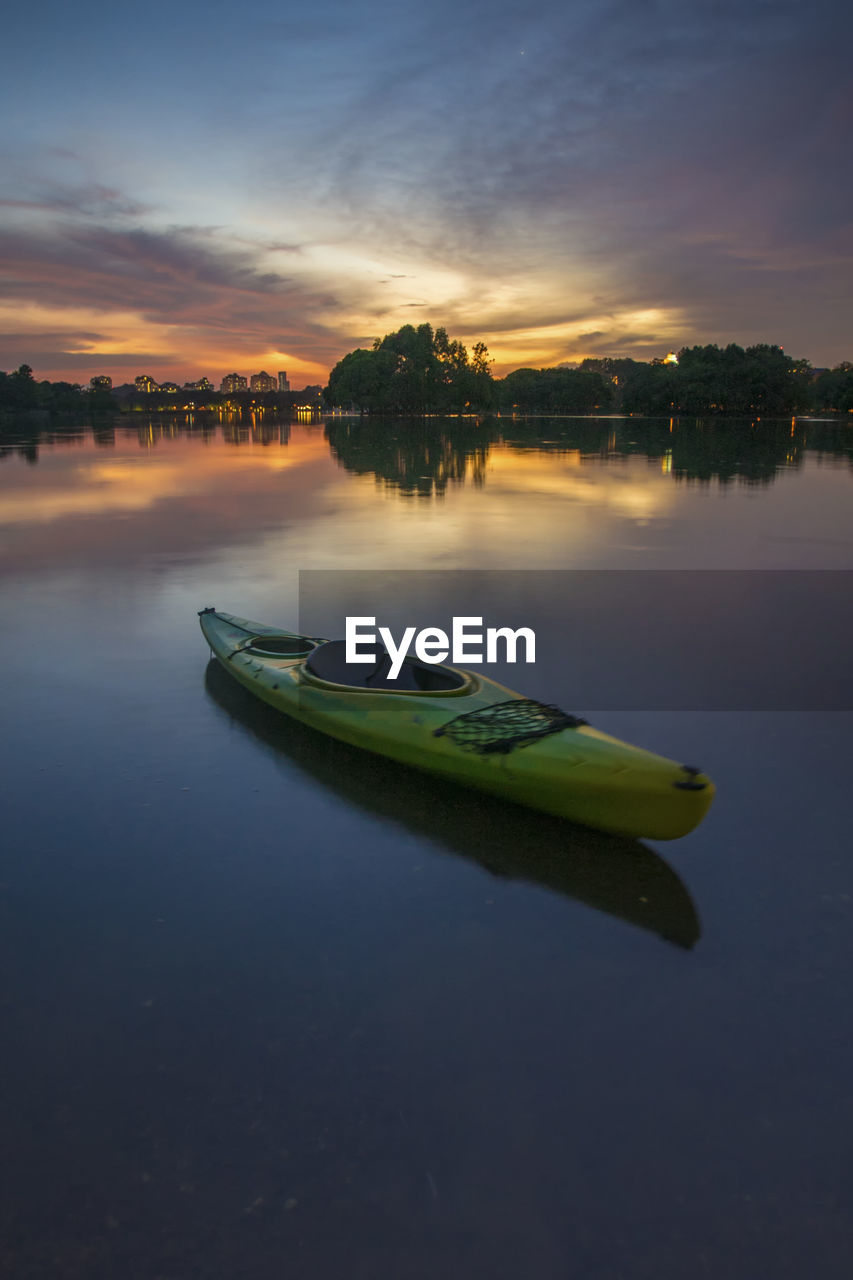 SCENIC VIEW OF LAKE AT SUNSET