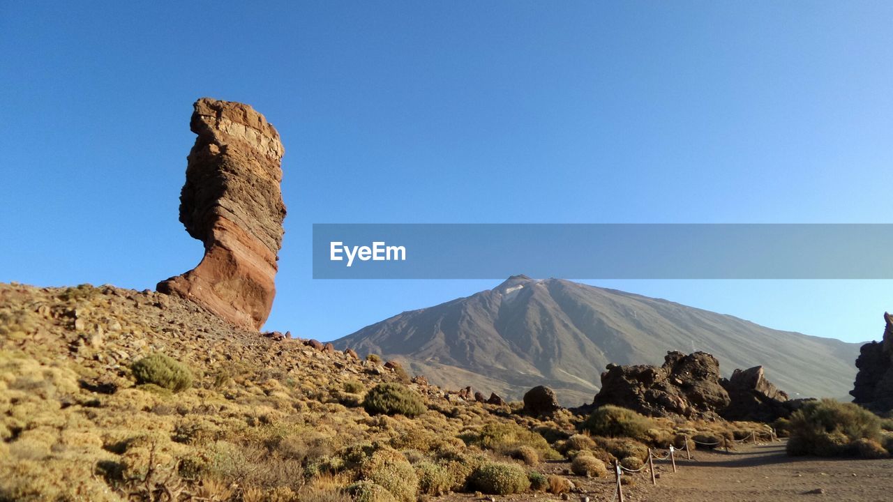 Scenic view of mountains against clear sky