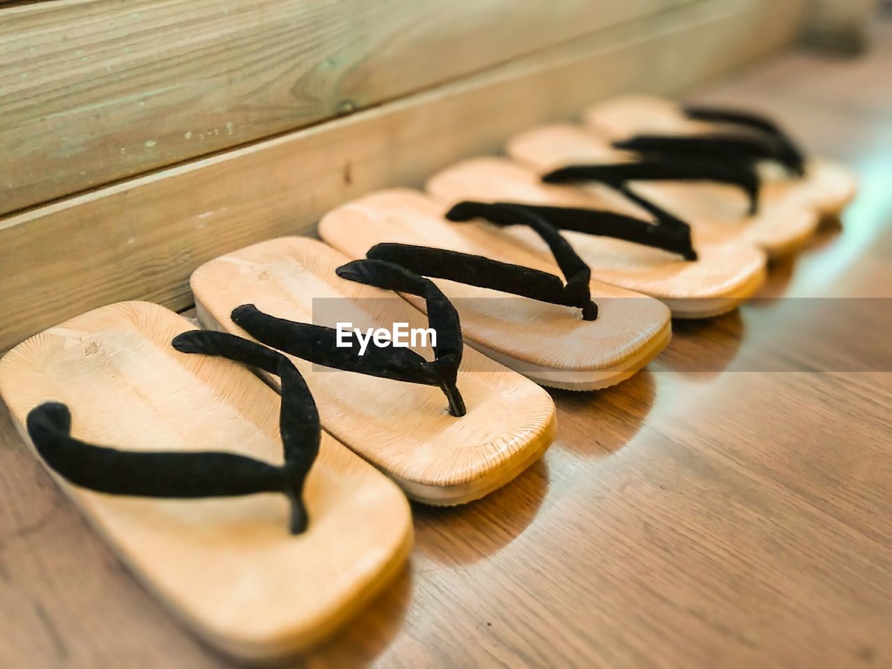 High angle view of japanese wooden clogs on floor