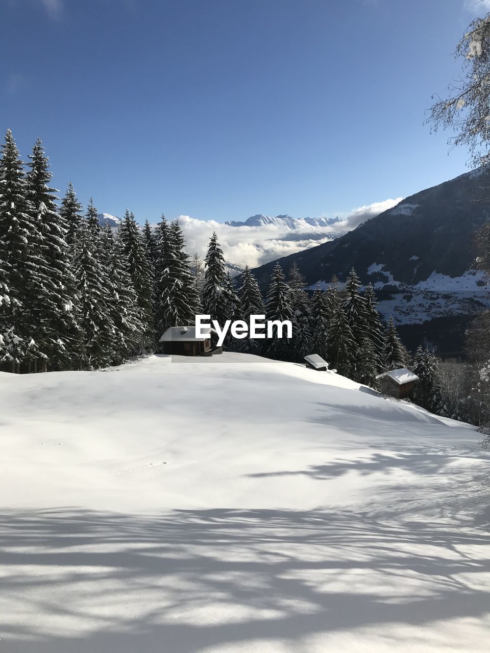 Scenic view of snow covered mountains against sky