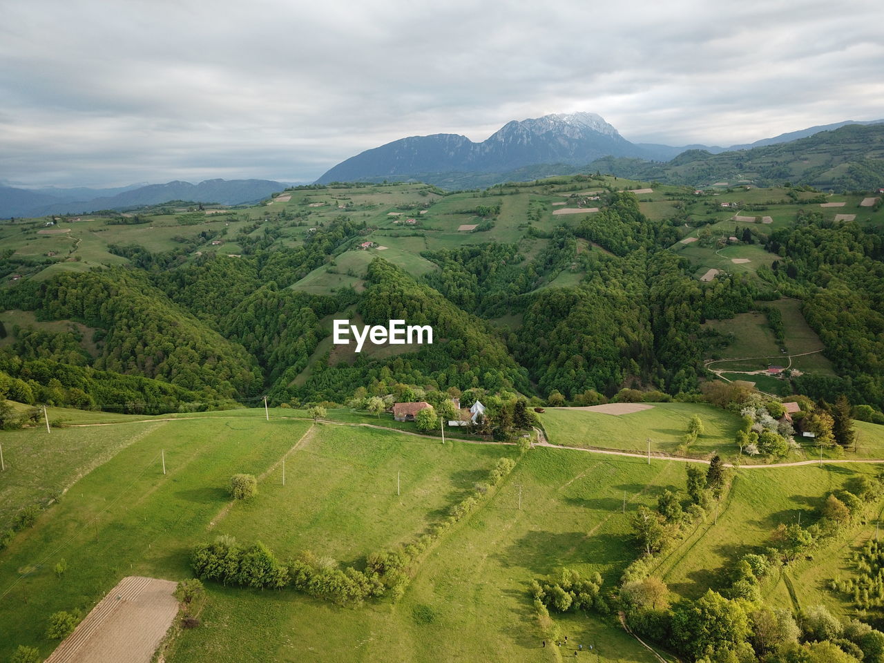 Scenic view of green landscape against sky