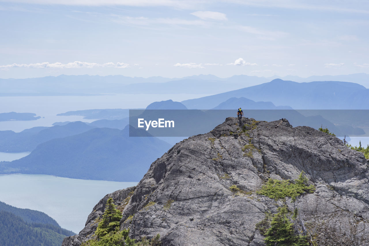 Man riding bicycle on rocks