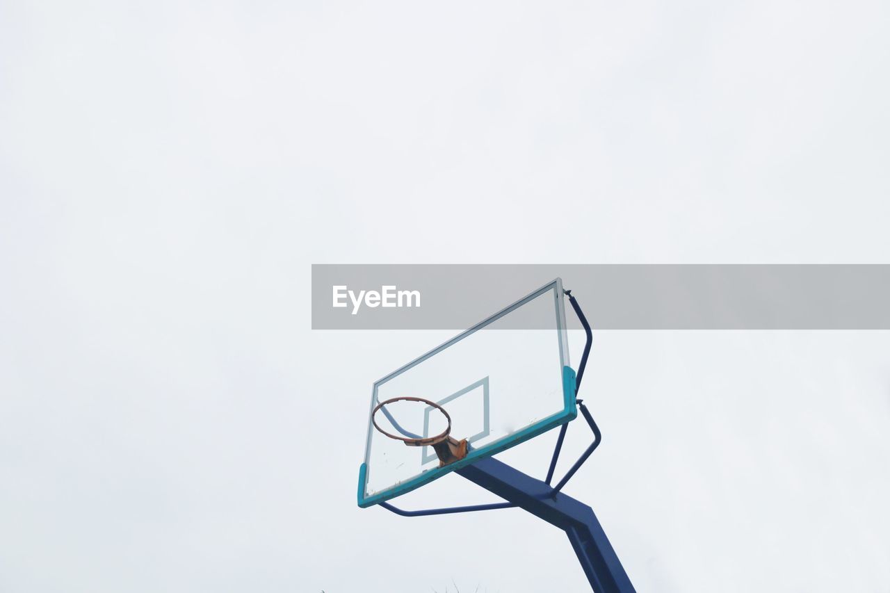 Low angle view of basketball hoop against clear sky