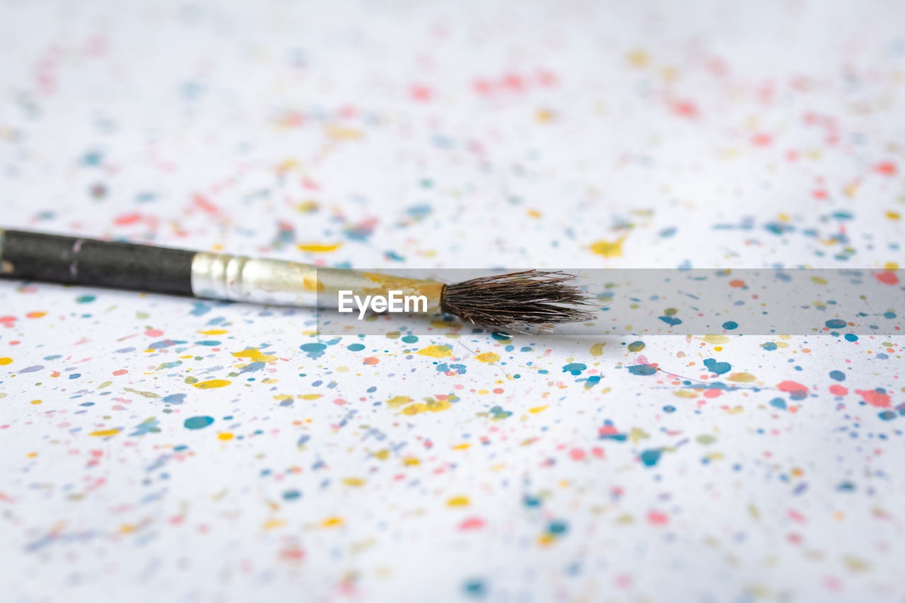 Close-up of paintbrush on table