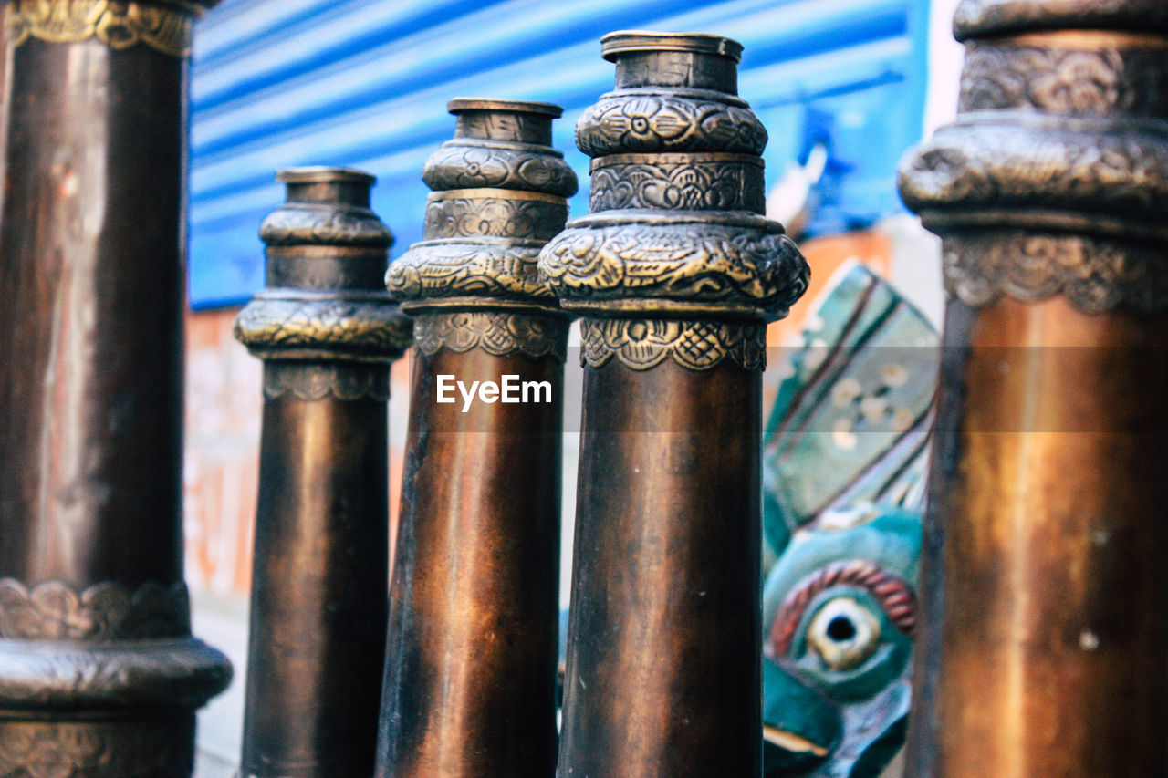 Close-up of old metallic structures at temple