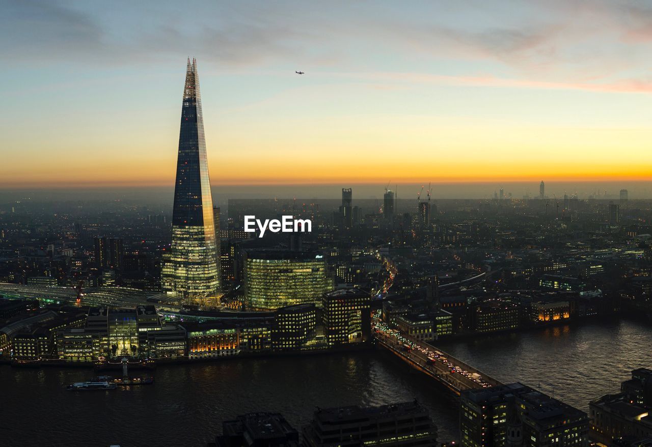 Aerial view of city at sunset