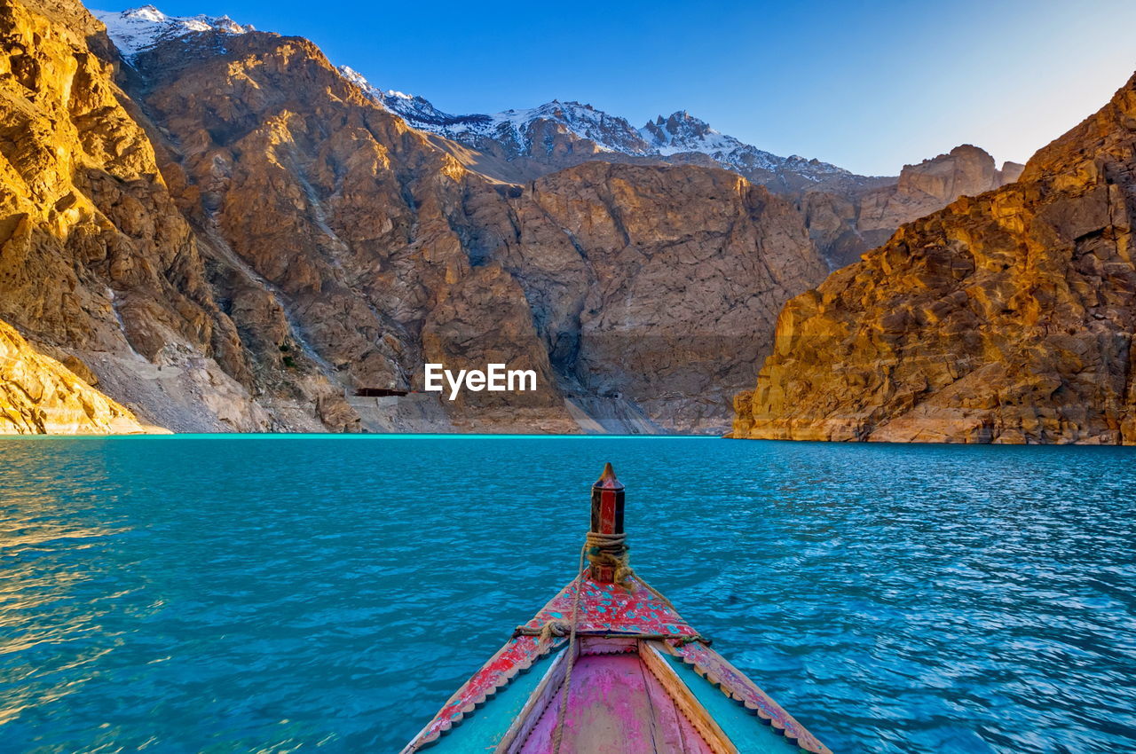 Scenic view of mountains against blue sky