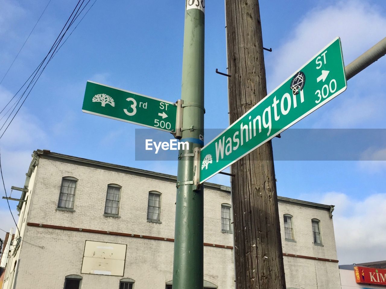 Low angle view of road sign against sky