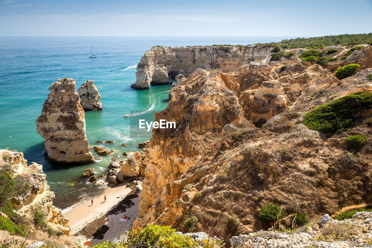 Panoramic view of sea and rock formation against sky