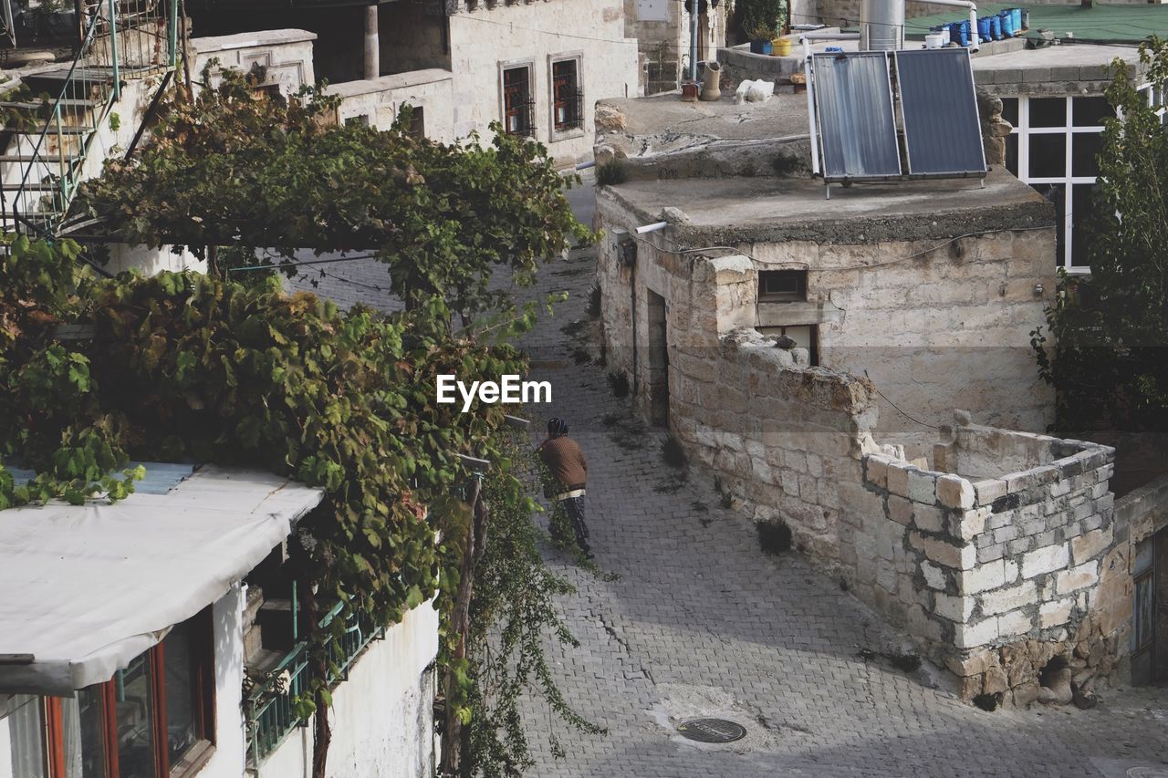 Walking in the alleyway. Architecture Built Structure Building Exterior Real People One Person Outdoors Walking Around Leisure Activity Enjoy The New Normal Old Buildings Old Town Old Tranquil Scene Street View View From Above Across The Street Crossing Pathway Alleyway Cappadocia Cappadocia/Turkey Old City Street Photography Finding New Frontiers Miles Away