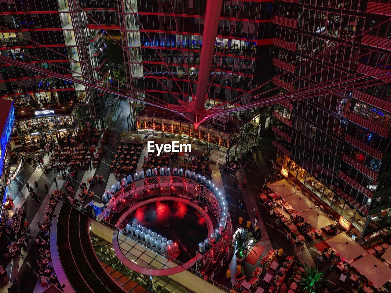 HIGH ANGLE VIEW OF ILLUMINATED BUILDINGS IN CITY