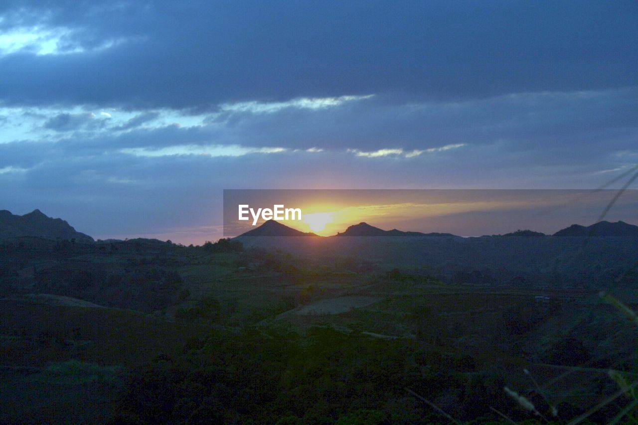 SUNSET OVER MOUNTAINS