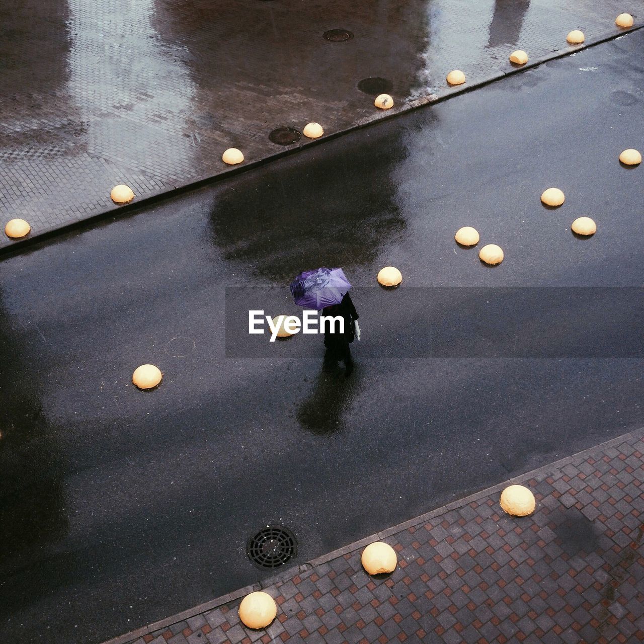 High angle view of person on wet road