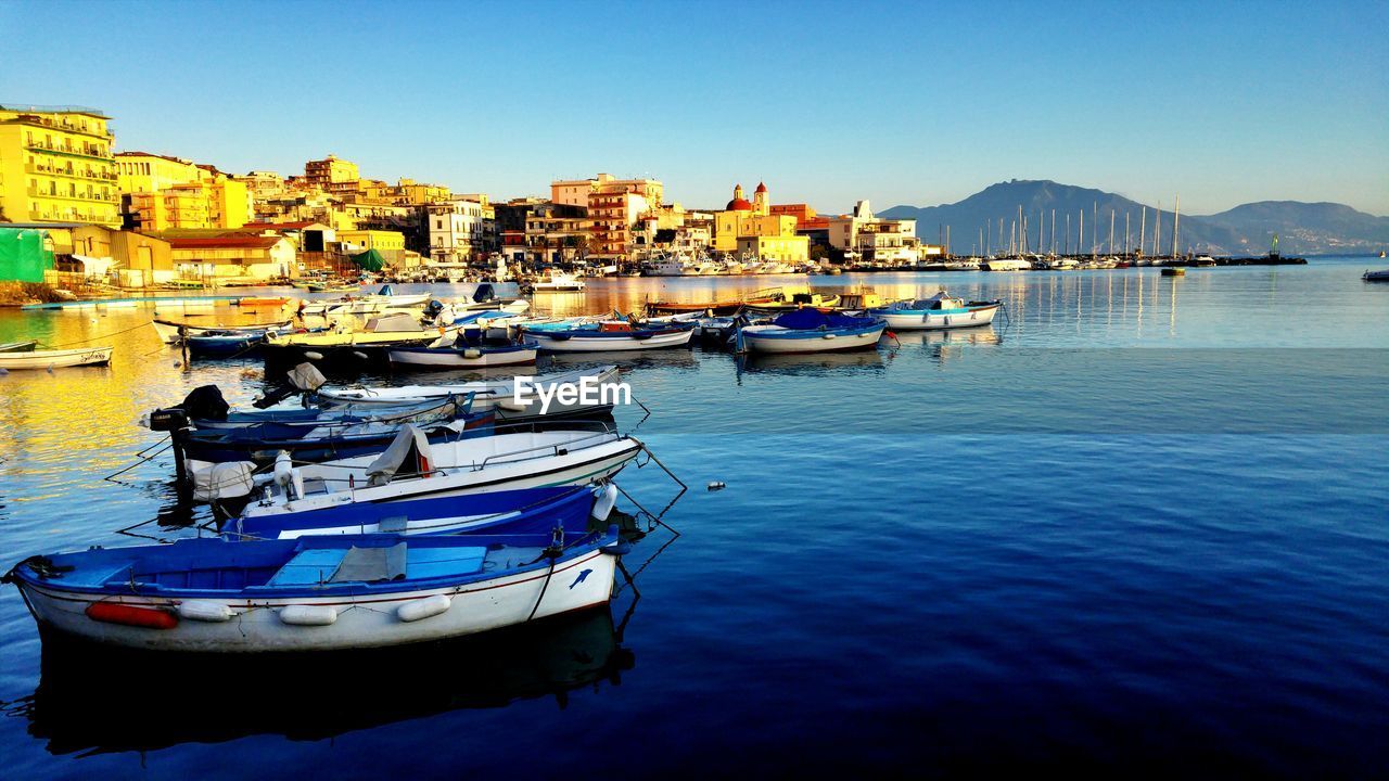 Boats moored at harbor