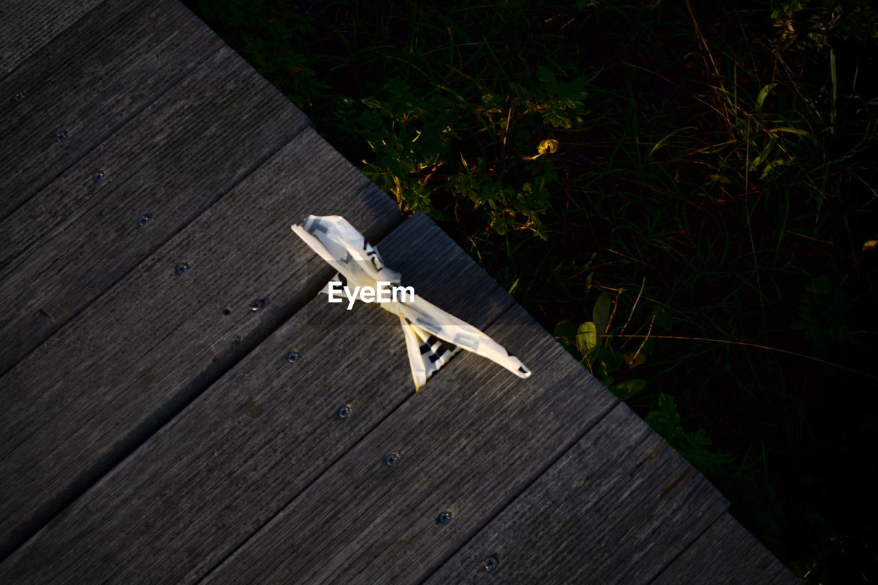 High angle view of wooden bench on table