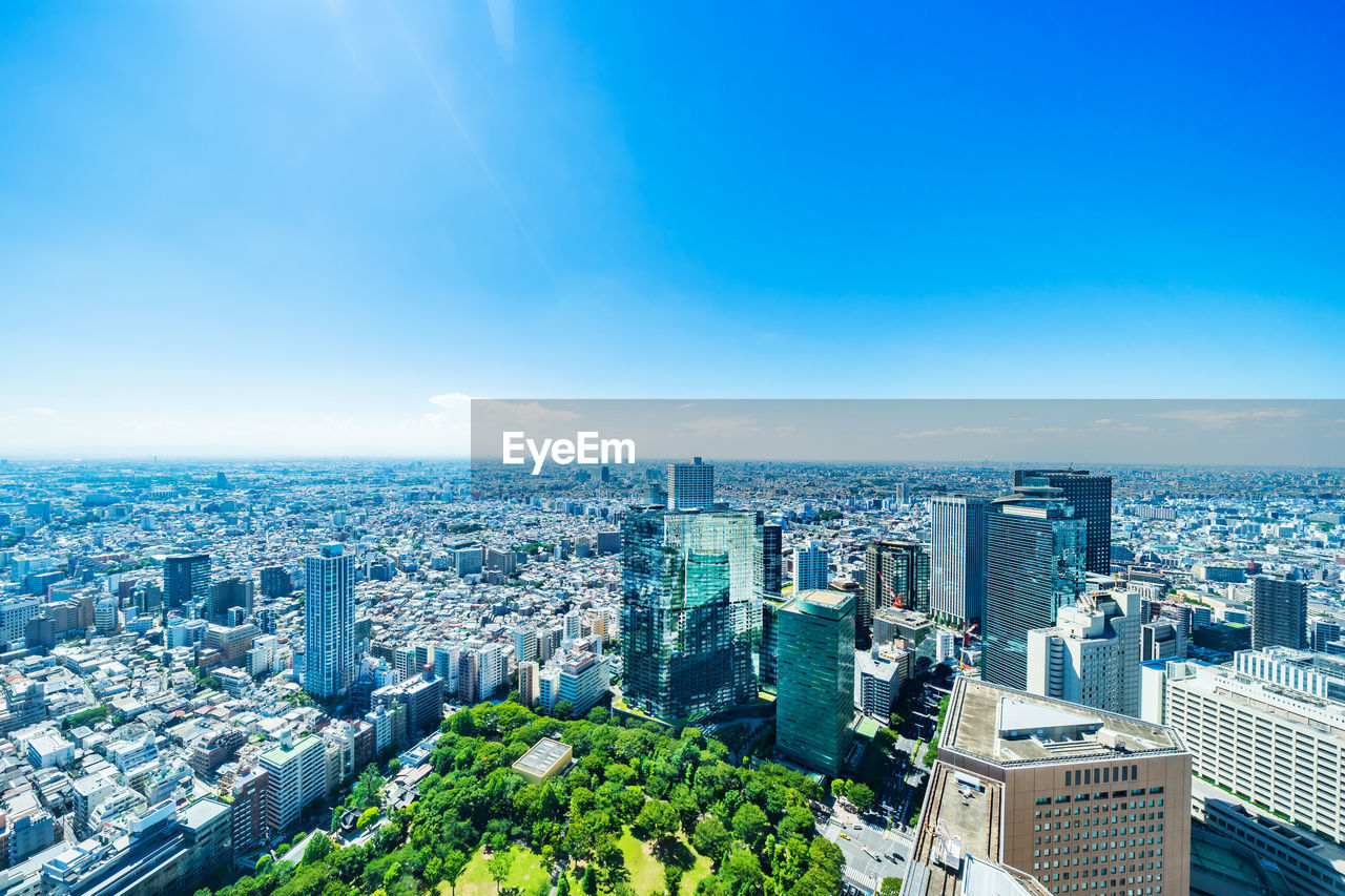 HIGH ANGLE VIEW OF BUILDINGS AGAINST SKY