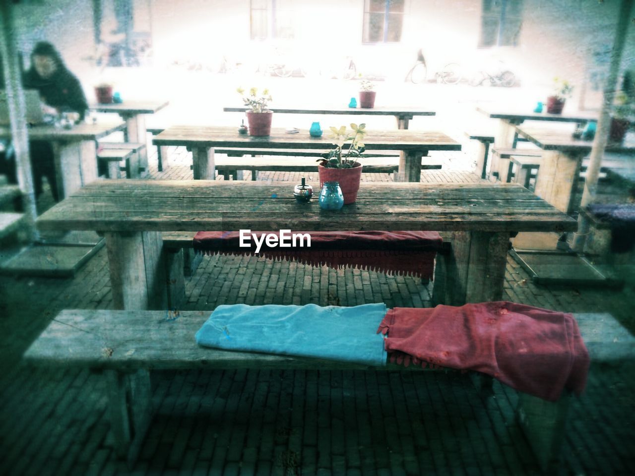 Wooden table and benches in restaurant