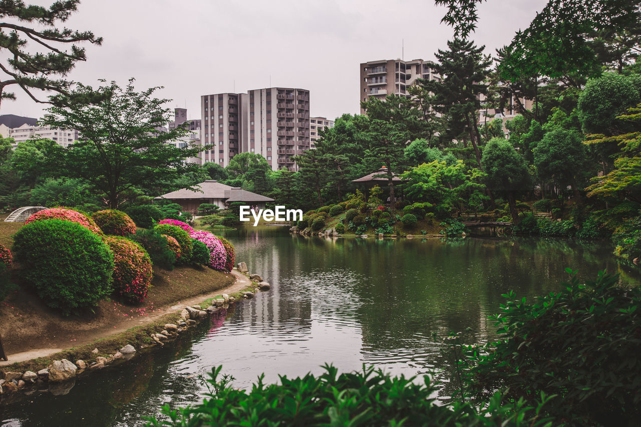 View on japanese style beautiful park with a pond in hiroshima city