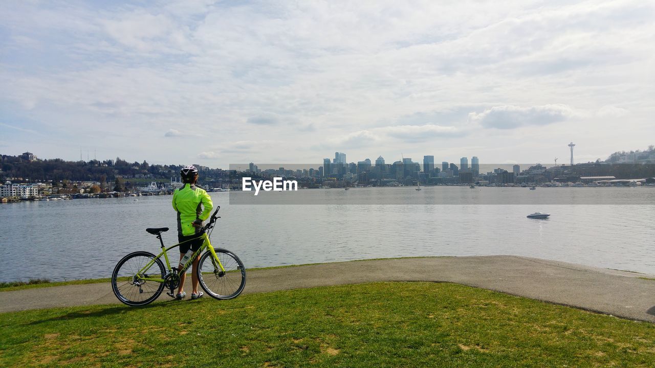 VIEW OF MAN WITH BICYCLE IN BACKGROUND