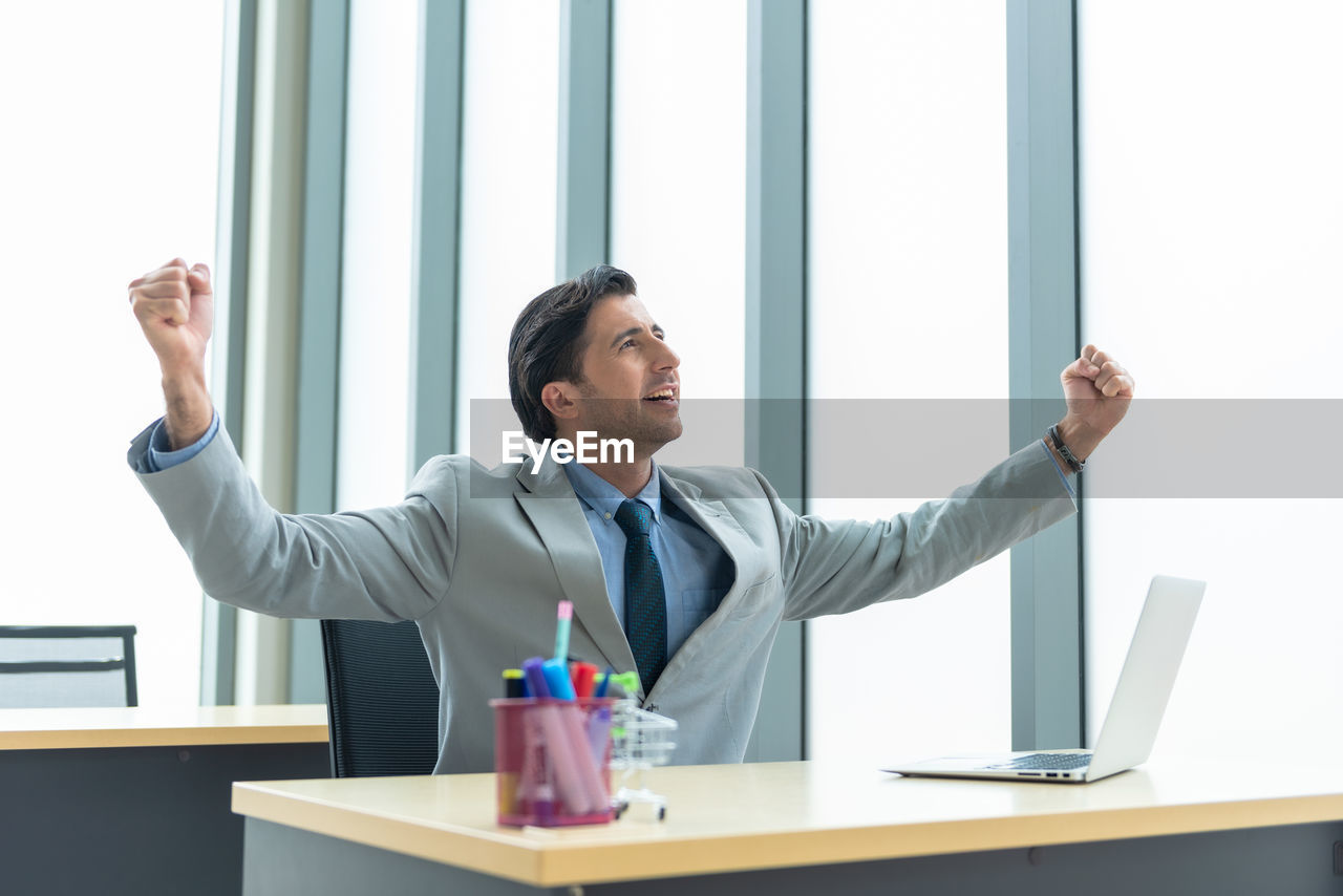 business colleagues shaking hands in office