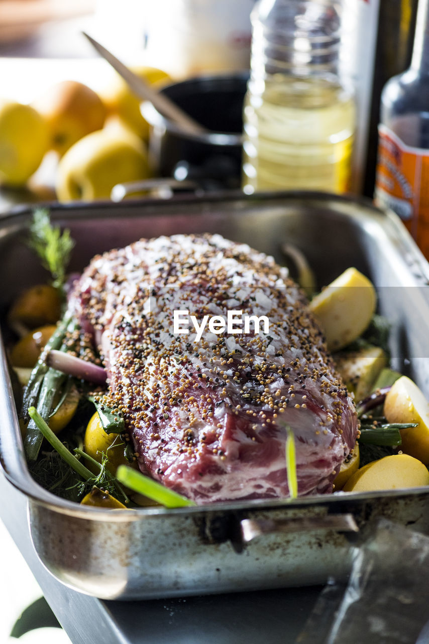 Close-up of roast pork in container