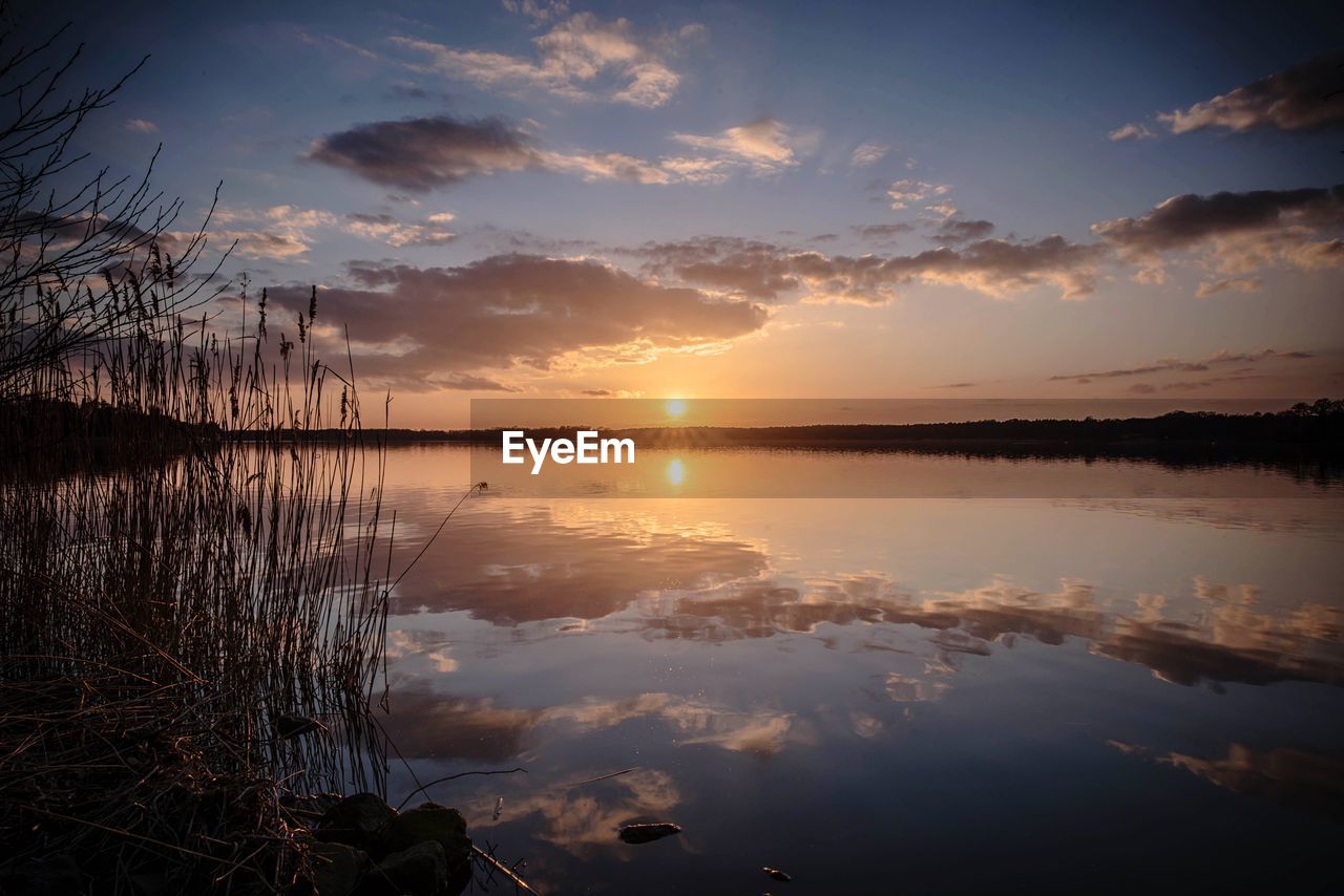 View of lake against sky during sunset