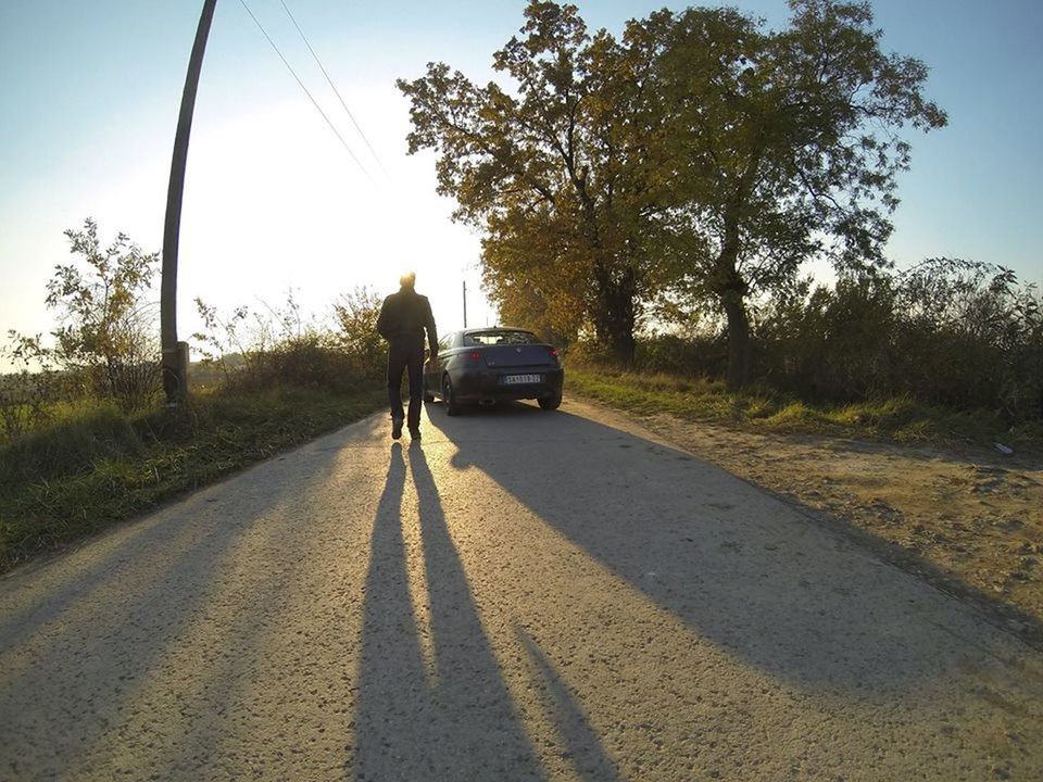 WOMAN WALKING ON ROAD