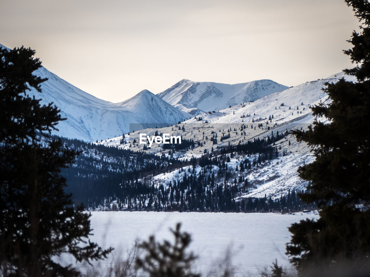 Scenic view of mountains against sky during winter