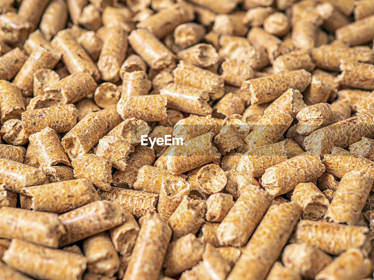 Natural wooden pellets background as renewable energy. close-up wood pellet pattern. top view