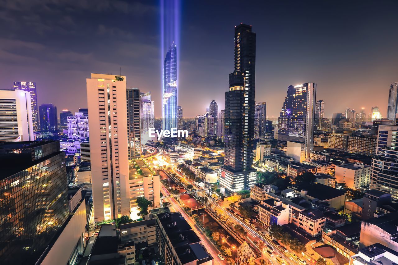 High angle view of illuminated buildings in city at night