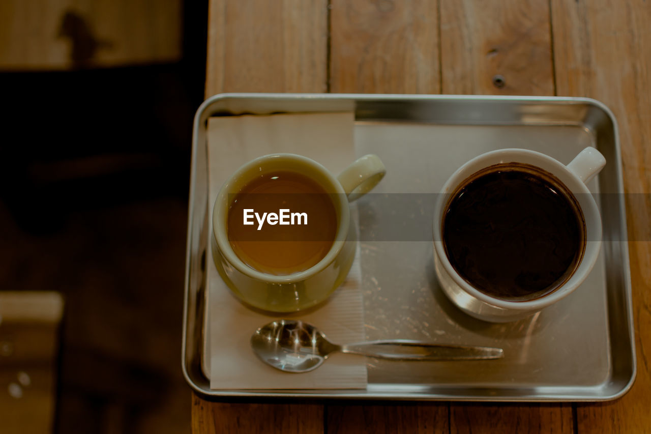 HIGH ANGLE VIEW OF COFFEE WITH TEA ON TABLE