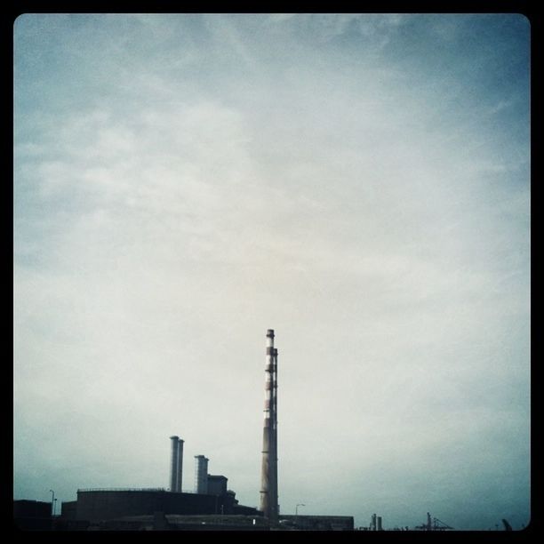 LOW ANGLE VIEW OF CONSTRUCTION SITE AGAINST CLOUDY SKY