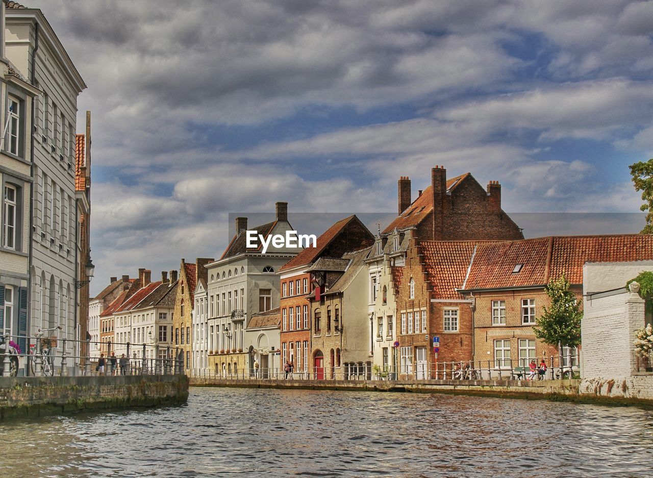 Houses in city against sky