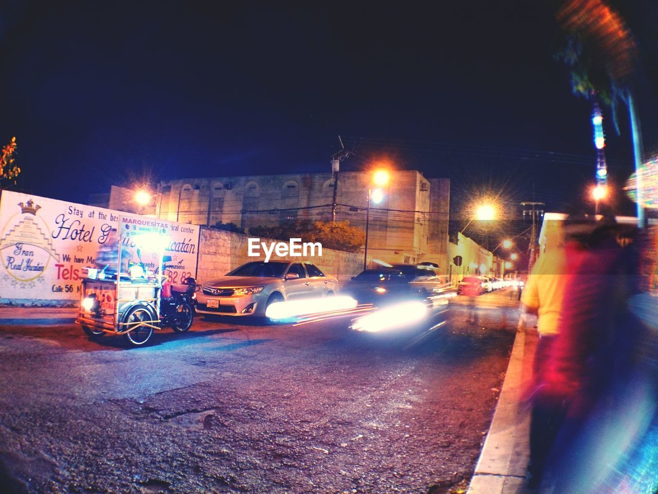 CARS ON STREET AT NIGHT