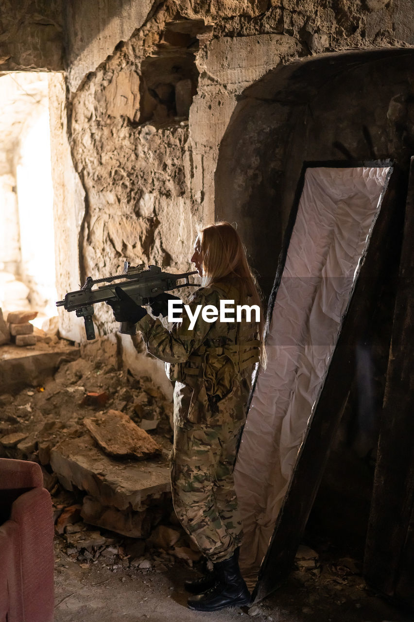 Side view of soldier in cave