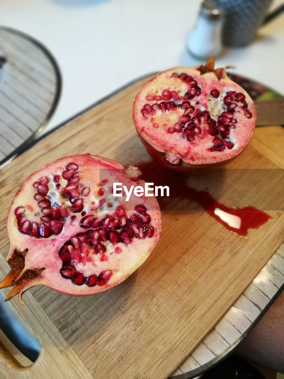 High angle view of pomegranate on cutting board