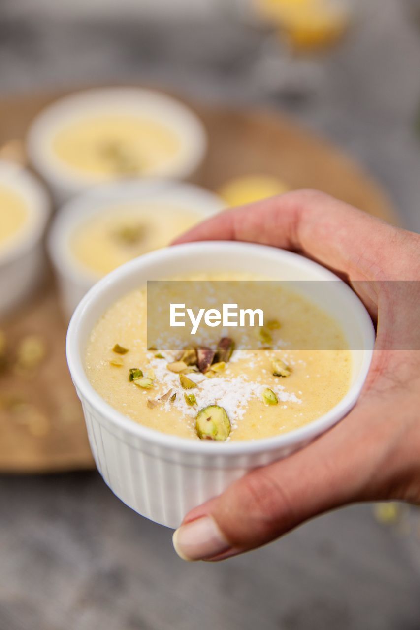 Close-up of hand holding bowl