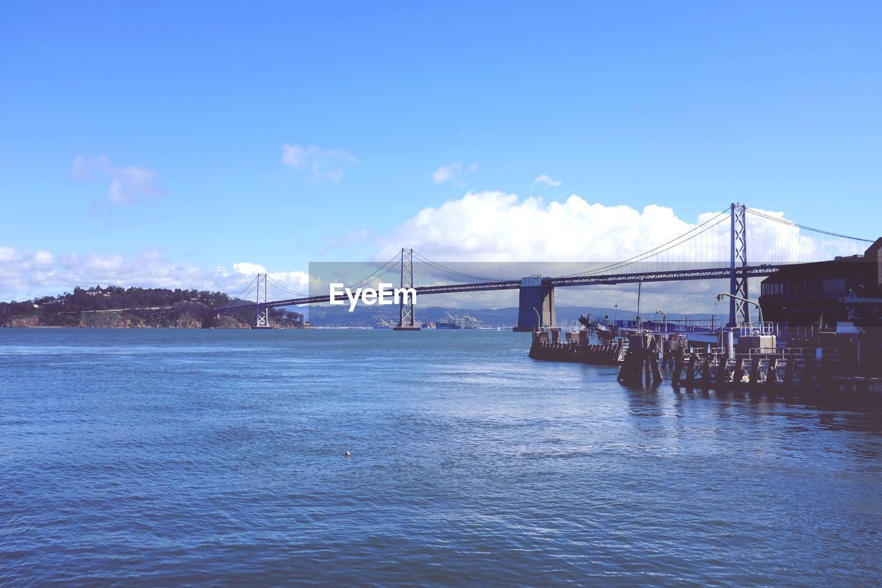 San franciscooakland bay bridge over sea against sky