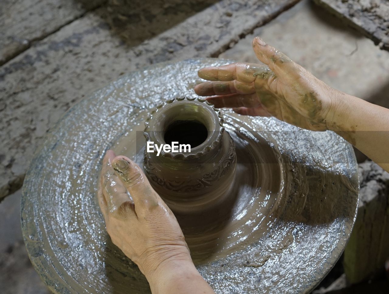 High angle view of woman hand sculpting claywork