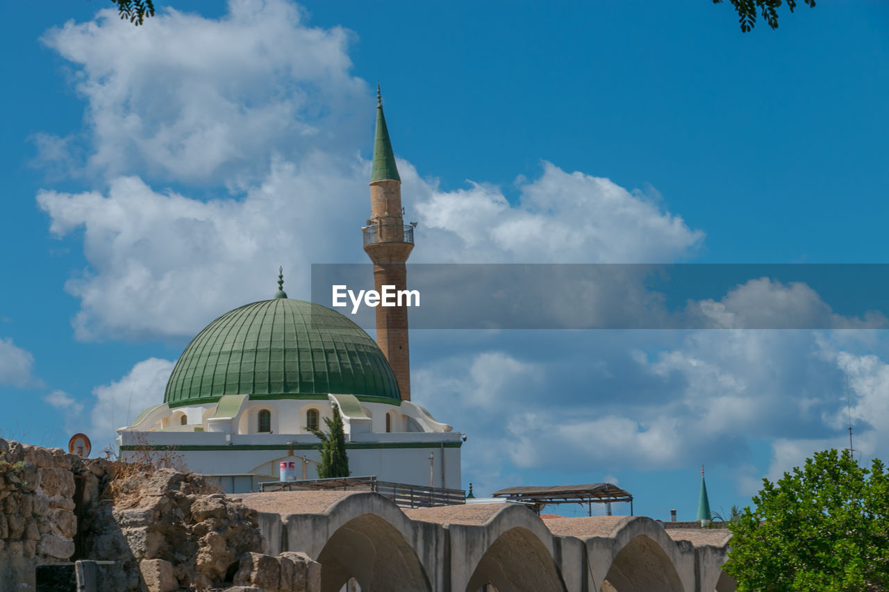 Low angle view of mosque against sky